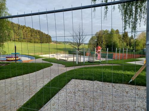 a view of a park with a playground at Schönes Ferienhaus mit großem Garten bei Stadlern in Stadlern