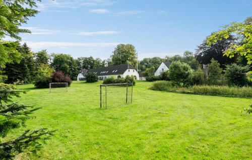 a field with two goal nets in the grass at Lovely Home In Nimtofte With Wifi in Nimtofte