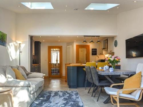 a living room with a couch and a table at Rowan House in Beverley