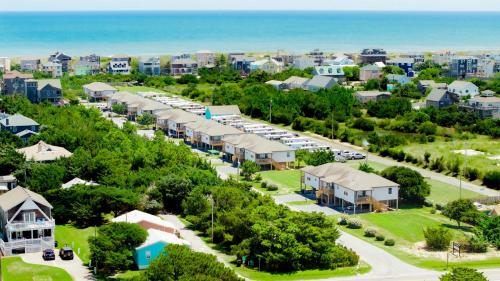 an aerial view of a resort with the ocean at Watermen's Cabana 1C - 3-Bed, 2-Bath Apartment - Walk To BEACH Access & PET Friendly! in Waves
