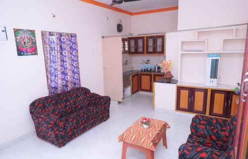 Kuchyň nebo kuchyňský kout v ubytování Bhudeve Stay Home