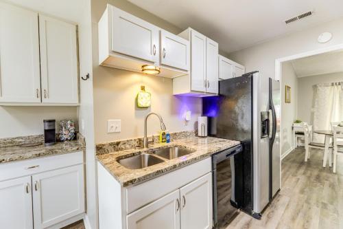 a kitchen with a sink and a refrigerator at Jacksonville Home By Camp Lejeune, Beaches and More! in Jacksonville
