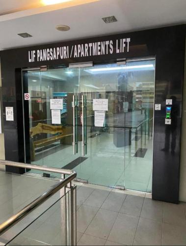 an entrance to an airport with a glass door at Crystal Studio Apartment KBCP in Kota Bharu