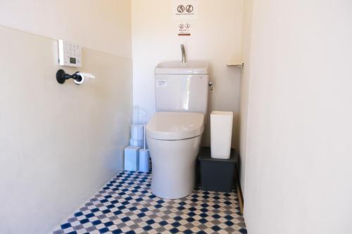 a bathroom with a toilet in a small room at Rosh - Private Sauna & Traditional Japanese House in Tateda