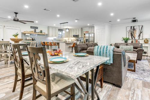 a kitchen and living room with a table and chairs at 2 Mi to Bay and Beaches Home with Gazebo in Daphne in Daphne
