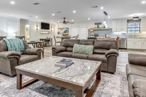 a living room with two couches and a coffee table at 2 Mi to Bay and Beaches Home with Gazebo in Daphne in Daphne