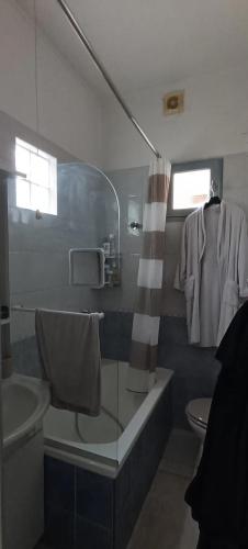 a bathroom with a shower and a toilet and a sink at Chambres à St Loup-Marseille in Marseille