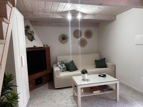 a living room with a couch and a table at Tenuta Moffa in Tramonti