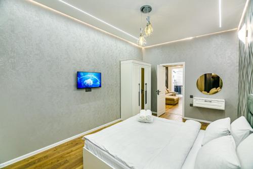 Ένα ή περισσότερα κρεβάτια σε δωμάτιο στο CHİNAR Apartment DeLux İn Fountain Square