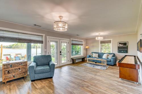 a living room with a couch and a table at Bayfront Milton Retreat with Dock and Game Room in Milton