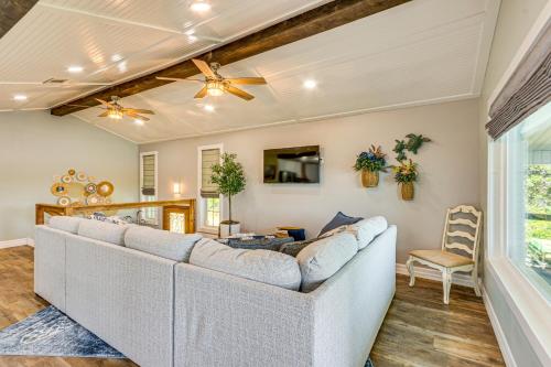 a living room with a couch and a table at Bayfront Milton Retreat with Dock and Game Room in Milton