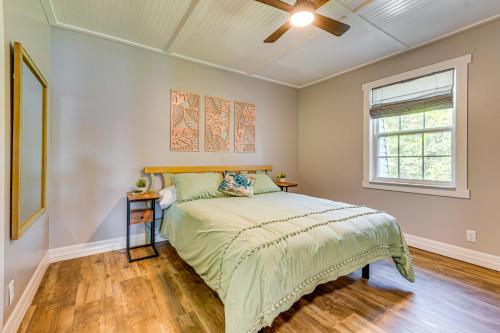 a bedroom with a bed and a window at Bayfront Milton Retreat with Dock and Game Room in Milton