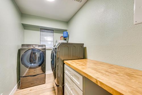 a laundry room with a washing machine and a counter at Bayfront Milton Retreat with Dock and Game Room in Milton