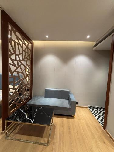 a bedroom with a blue bed in a room at The Blu in Ghaziabad