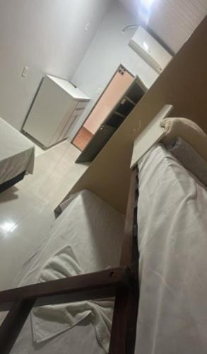 a room with a bunk bed in a room at Hotel Porto Sollar in Porto Nacional