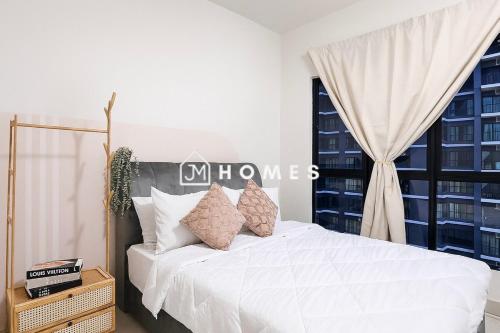 a bedroom with a white bed with pillows and a window at Majestic Maxim near USCI MRT 康乐夜市 #12 in Kuala Lumpur