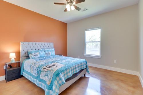 a bedroom with a bed and a ceiling fan at Quiet Hill Country Home 1 Mi to Lake LBJ Access! in Granite Shoals