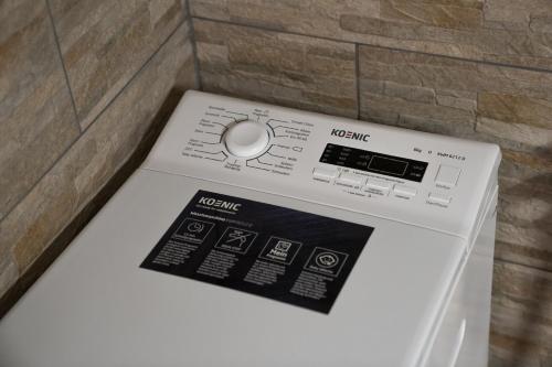 a washing machine with a label on top of it at Haus Kärnten in Döbriach