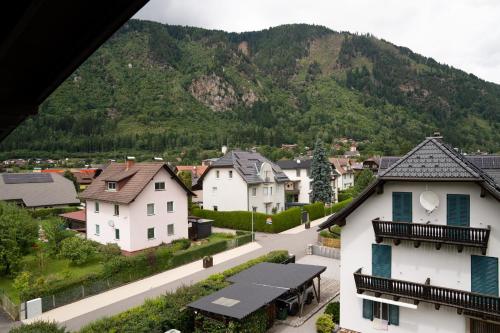 a town with houses and a mountain in the background at Haus Kärnten in Döbriach