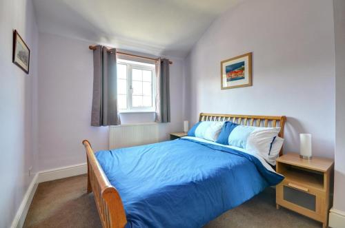 En eller flere senge i et værelse på Crossing Keepers Cottage