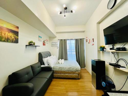 TV a/nebo společenská místnost v ubytování The Loop Limketkai Center 6F Condo