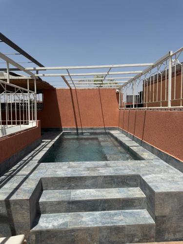 a walkway on the side of a building at Riad Dihya in Marrakech