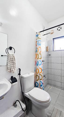 a bathroom with a toilet and a sink at 3bdrm Mombasa CBD Aircon gym, washer ,free pool in Mombasa