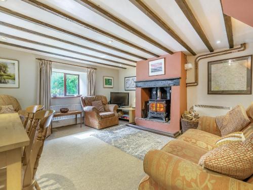 Posezení v ubytování Widows Cottage