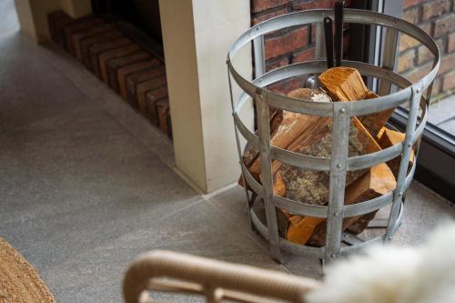 a metal basket full of breads at Dutchen Villapark Mooi Schoorl in Schoorl