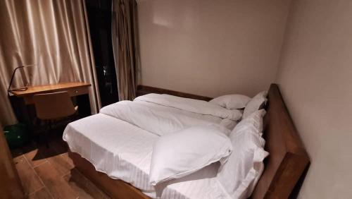 Postel nebo postele na pokoji v ubytování Cocopark Hotel