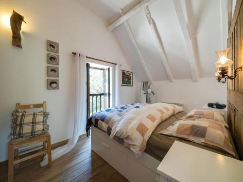 a bedroom with two beds and a window at Sunny Watermill with Heated Pool in Brandonnet
