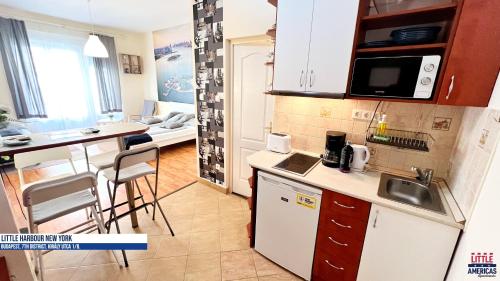 a kitchen with a sink and a counter top at Little New York West Side Apartments in Budapest
