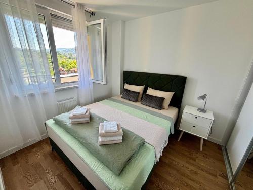 Postel nebo postele na pokoji v ubytování Apartman Leo