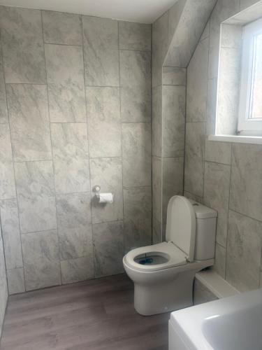 a bathroom with a white toilet and a sink at Blencathra in Penrith