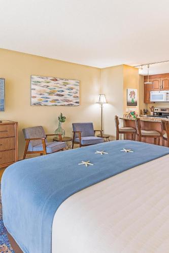 a hotel room with a bed and a kitchen at Kaanapali Shores Studio #642 in Lahaina