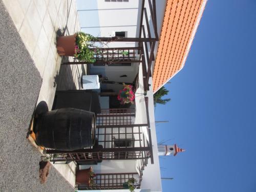 an overhead view of a building with stairs and plants at Casa Formiga in Fajã da Ovelha