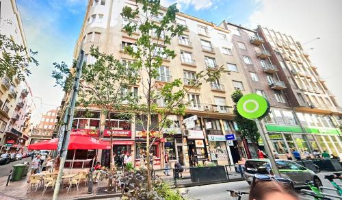 a city street with a green frisbee in front of a building at Little New York West Side Apartments in Budapest