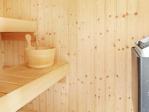 a wooden container sitting on a shelf in a sauna at 6 person holiday home in Ringkøbing-By Traum in Søndervig