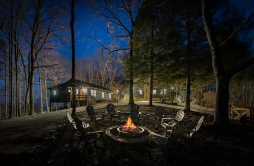 a fire pit in a park at night at Eagles Haven - Two Cabins with Massive Deck & Views in Blue Ridge
