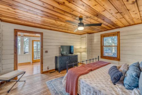a bedroom with a bed and a wooden ceiling at Eagles Haven - Two Cabins with Massive Deck & Views in Blue Ridge