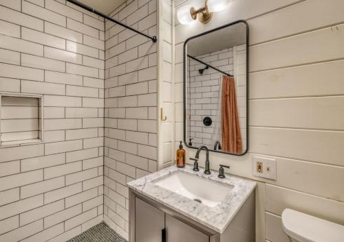 a bathroom with a sink and a mirror at Eagles Haven - Two Cabins with Massive Deck & Views in Blue Ridge