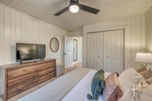 a bedroom with a flat screen tv and a bed at Eagles Haven - Two Cabins with Massive Deck & Views in Blue Ridge