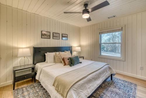 a bedroom with a large bed and a window at Eagles Haven - Two Cabins with Massive Deck & Views in Blue Ridge