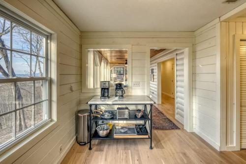 a kitchen with a cart in a room with a window at Eagles Haven - Two Cabins with Massive Deck & Views in Blue Ridge