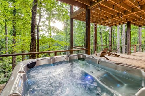 a hot tub in a house in the woods at Greenridge- Upscale Architecture and Modern Design in Blue Ridge