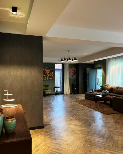 a living room with a couch and a table at Ateni Hills in Gori
