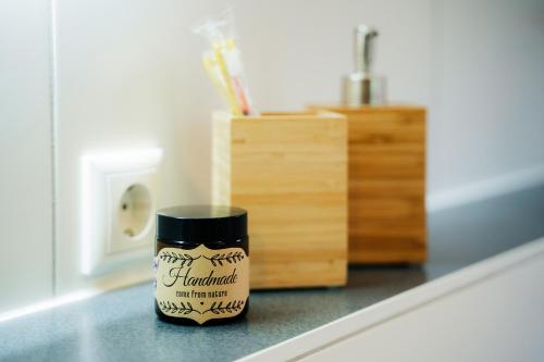 a jar of homemade toothpaste sitting on a counter at Select-Home 2 - Netflix - Kaffee&Tee - Parkplatz - viele Extras in Bruck in der Oberpfalz