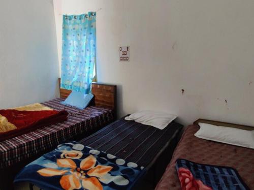 Cama o camas de una habitación en Hotel Yamdagni Rishi