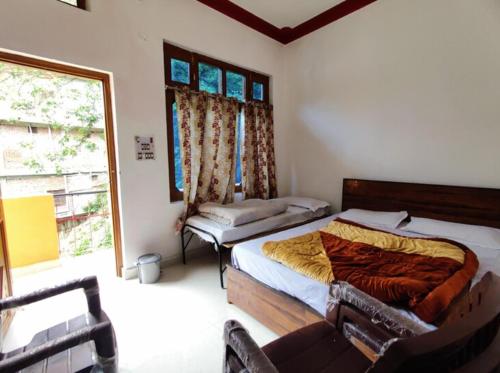 Cama o camas de una habitación en Hotel Yamdagni Rishi