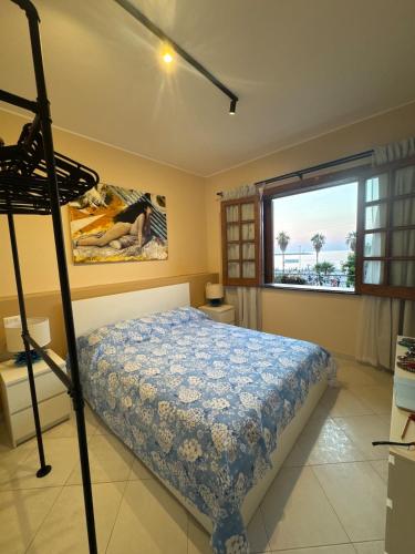 Ένα ή περισσότερα κρεβάτια σε δωμάτιο στο Casa Clara Vista Mare & Design